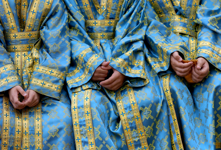 Altar boys Edward Shontz, 10, Dean Kotakis, 12, Fotie Spiliotopoulos, 12, wait to be called to perform in the parade before the diving of the cross at the 99th Annual Epiphany celebration in Tarpon Springs, Fla. : Moments : Madison | Milwaukee | Chicago | Writer | Photographer | Keri Wiginton | Portrait photography | Travel | Corporate | Photojournalist | Editorial | Environmental