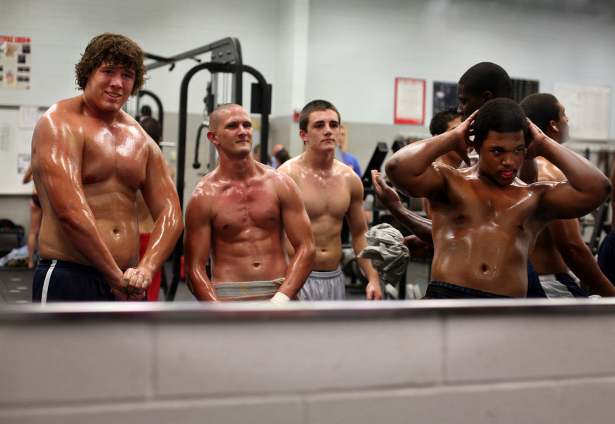 Charles Van Zandt, from left, Calvin Byerly, Jeremy Henderson and C.J. Bettis practice their poses in the weight room before the start of the ninth annual Mr. and Miss Wesley Chapel bodybuilding contest in Wesley Chapel, Fla.  : Moments : Madison | Milwaukee | Chicago | Writer | Photographer | Keri Wiginton | Portrait photography | Travel | Corporate | Photojournalist | Editorial | Environmental