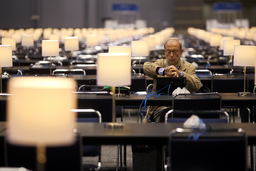 An Italian journalist checks the time the day before the start of the 2012 NATO Summit in Chicago.  : Moments : Madison | Milwaukee | Chicago | Writer | Photographer | Keri Wiginton | Portrait photography | Travel | Corporate | Photojournalist | Editorial | Environmental