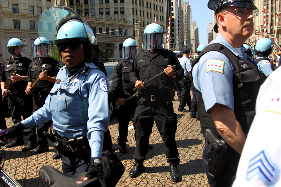 Police officers guard a bridge in downtown Chicago during the NATO conference.  : Moments : Madison | Milwaukee | Chicago | Writer | Photographer | Keri Wiginton | Portrait photography | Travel | Corporate | Photojournalist | Editorial | Environmental