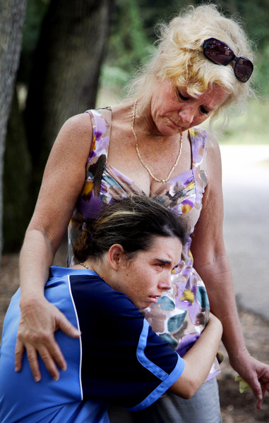 Sylvia Neeley, 48, comforts her daughter Jenny, 23, outside of the group home where Jenny now lives in Florida's Pasco County. Jenny clings tightly to her mother two days before Sylvia must report to her prison sentencing. Sylvia Neeley received a 10-year term for shooting Arthur Danner, a man she believed was molesting her mentally disabled daughter when she was 12. : Moments : Madison | Milwaukee | Chicago | Writer | Photographer | Keri Wiginton | Portrait photography | Travel | Corporate | Photojournalist | Editorial | Environmental